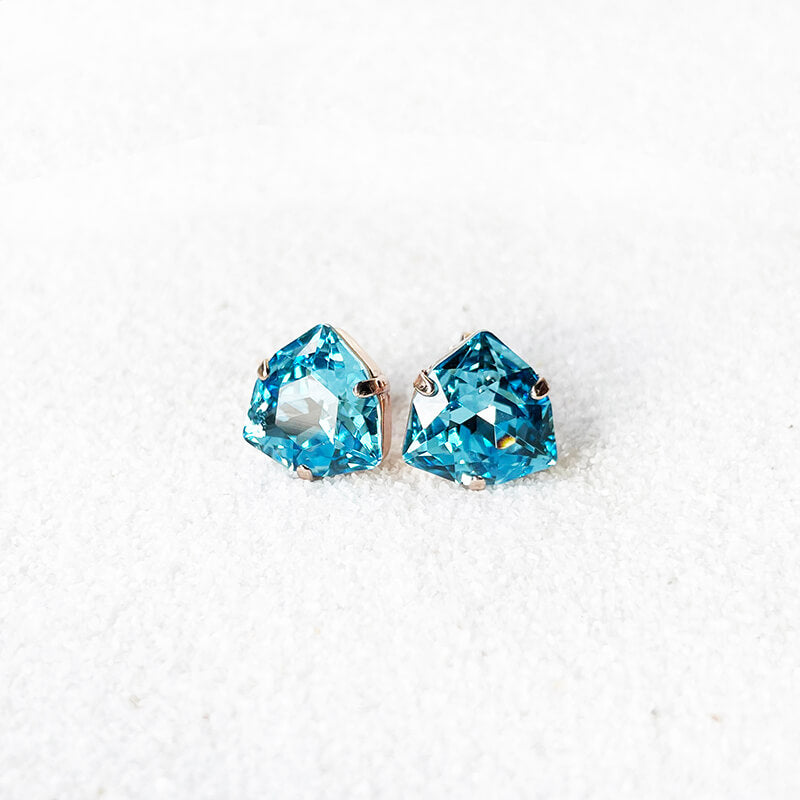 Aquamarine stud earrings with a blue swarovski set in rose gold 